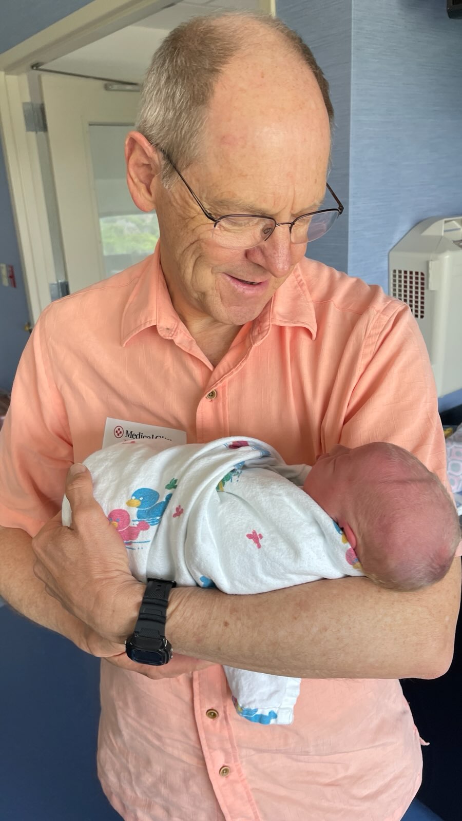 Dr. Moffitt holding his new granddaughter a few days before Mother's Day | Arizona Reproductive Medicine | Phoenix, AZ
