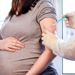 Pregnant woman getting covid vaccine | Arizona Reproductive Medical Specialists