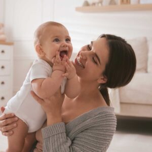 Mother smiles at her child, conceived with the help of Arizona Reproductive Medicine in Phoenix, AZ